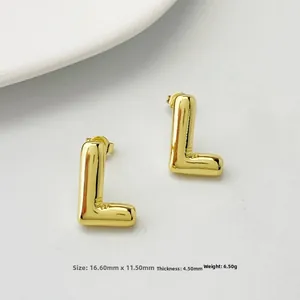 Detail view of gold polished 3D balloon letter L earring with precise dimensions