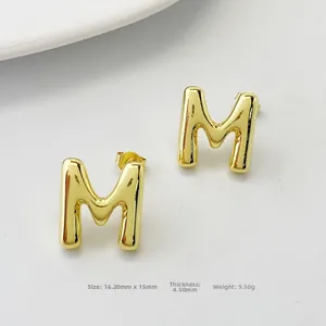 Detailed view of gold puff 3D letter M stud earring with dimensions and weight data
