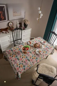 Detail of French vintage floral tablecloth featuring a unique embroidered scallop edge design