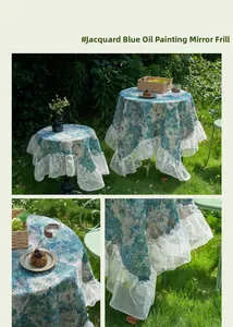 Detail of blue Monet oil painting style jacquard tablecloth with white lace ruffle edges