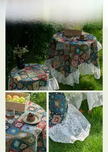 Close-up of vintage blue jacquard tablecloth featuring white lace ruffle edges on grass