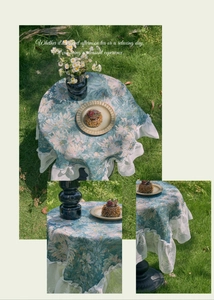 Close-up of floral jacquard tablecloth featuring elegant white lace edges and floral patterns