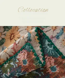 Close-up of jacquard fabric with vintage floral pattern and green scalloped edge detail