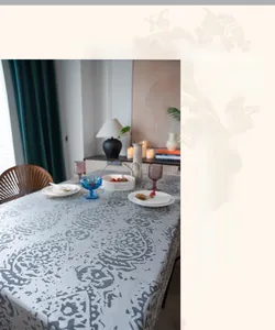 Close-up of vintage floral jacquard tablecloth fabric with thick texture and grey patterns