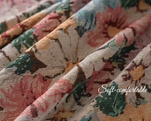 Detailed close-up of French vintage floral jacquard fabric with soft folds and elegant texture