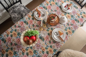 Close-up of French vintage floral jacquard tablecloth with colorful garden patterns