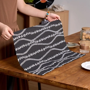 Nordic style black cloth napkin with white floral pattern and premium linen texture