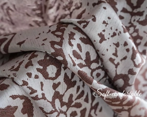 Macro detail of brown damascus jacquard curtain fabric with soft and comfortable texture