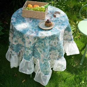Blue floral tablecloth with lace ruffles and pink flower print for outdoor round tables