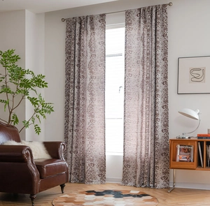 Close-up of brown Paisley jacquard curtains with elegant drape and rod pocket style