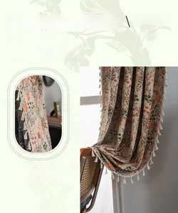 Detail of bohemian floral leaf embroidery on polyester curtain with tassel trim