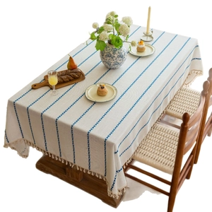 Rectangular cream table cloth with blue vertical embroidery and elegant tassel edges