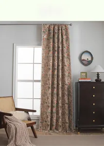 Close-up of bohemian jacquard curtain featuring floral leaf texture and white tassel fringe
