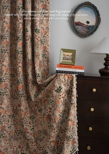 Detail view of bohemian jacquard curtain with floral texture and elegant tassel trim