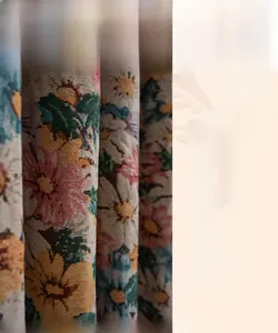 Detailed view of colorful floral jacquard weave curtains with elegant tassel fringe texture