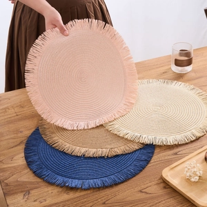 Modern circular woven placemat with tassels in beige, pink, coffee, and blue colors