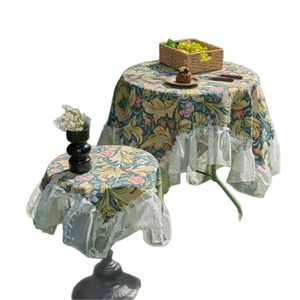 Vintage green floral tablecloth with carnation patterns and white lace ruffle edges