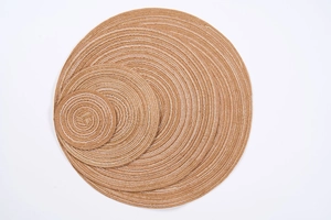 Three-piece set of woven round placemats in natural brown with white stitching detail