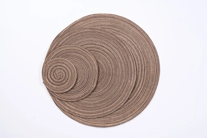 Detailed view of four circular woven heat-resistant placemats in brown striped cotton fiber