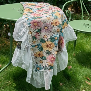 European style pink floral jacquard tablecloth with elegant white lace trim on outdoor table