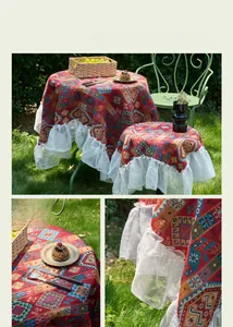 Detail of red jacquard tablecloth with elegant white lace ruffled edges for garden decor