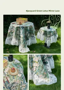 Detailed view of bohemian blue geometric jacquard fabric with white lace floral trim