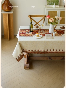 Detail of bohemian red rhombus jacquard tablecloth with textured cotton fabric