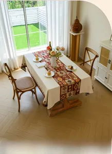 Close-up of bohemian red geometric jacquard tablecloth with thick woven texture and patterns