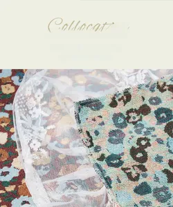 Close-up of high-density jacquard fabric with floral patterns and white lace edges