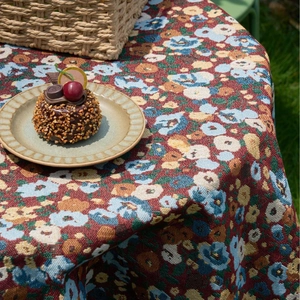 Vintage red jacquard tablecloth with floral pattern and lace edge for outdoor picnic