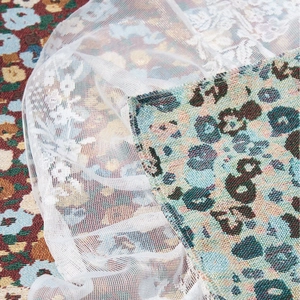 Lace ruffle tablecloth with vintage red jacquard and floral embroidery details