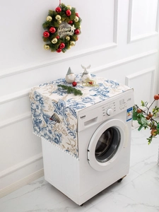 Side storage pocket on floral dust cover for washing machines with white pompom tassels