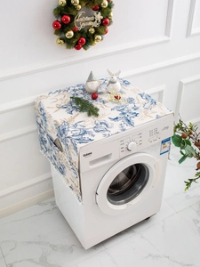 Detail of Christmas fridge cover with blue floral patterns and side storage pockets