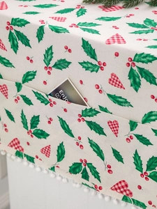 Detail of Christmas fridge cover showing storage pocket, heart prints, and pom pom trim