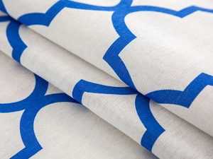 Close-up of blue geometric morocco pattern on white cotton linen fabric cover