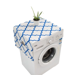 Blue geometric refrigerator dust cover with side storage pockets and white pom-poms