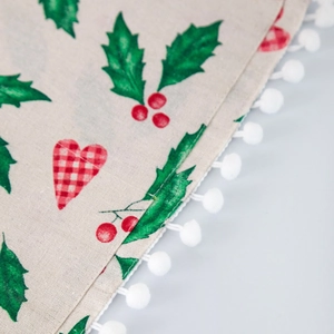 Linen microwave dust cover with Christmas holly patterns and white pom-pom fringe edge