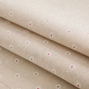Close-up of linen fabric texture with daisy print for refrigerator dust cover