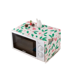 Christmas microwave dust cover in linen with holly leaves patterns and side storage pockets