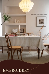 Detail of premium cream 3D jacquard embroidery with elegant floral pattern on table cloth
