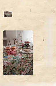 Detail of vintage bohemian tablecloth featuring realistic floral leaves and butterfly patterns