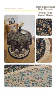 Detailed view of black plum blossom pattern round tablecloth with elegant white tassels