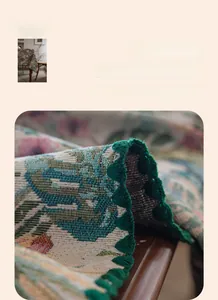 Close-up of bohemian floral tablecloth with reinforced dark green scalloped embroidery edges