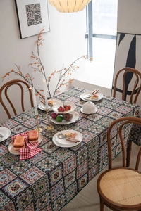 Detail of vintage French jacquard tablecloth with colorful geometric patchwork design