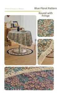 Close-up of blue floral jacquard fabric and white fringed edge on round tablecloth