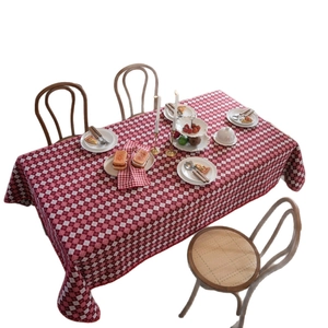 Classic red and white checkered rectangular tablecloth with matching napkins for dining
