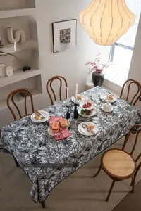 Detail of retro black and white floral jacquard tablecloth with 3D shell embroidery