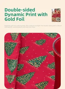 Detail of red Christmas table runner with gold foil stamping and festive tree patterns