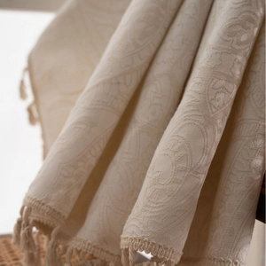 Cream white jacquard curtain with elegant tassels and damask pattern texture