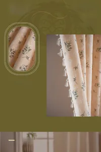 Detail of floral printed beige curtain with elegant white tassels on fine polyester fabric